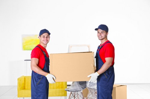 Professional movers unloading boxes at a new Eastcote property